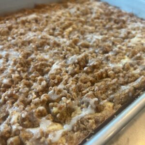 Freshly baked cinnamon crumb coffee cake in a pan.