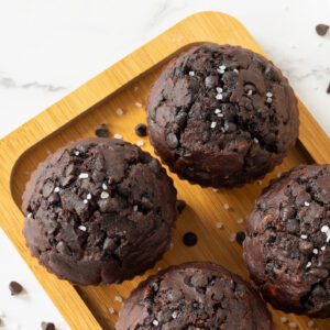 Chocolate chip muffins on a wooden tray