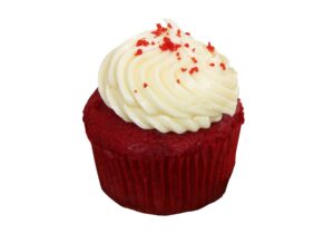 A red velvet cupcake with white frosting and red sprinkles.